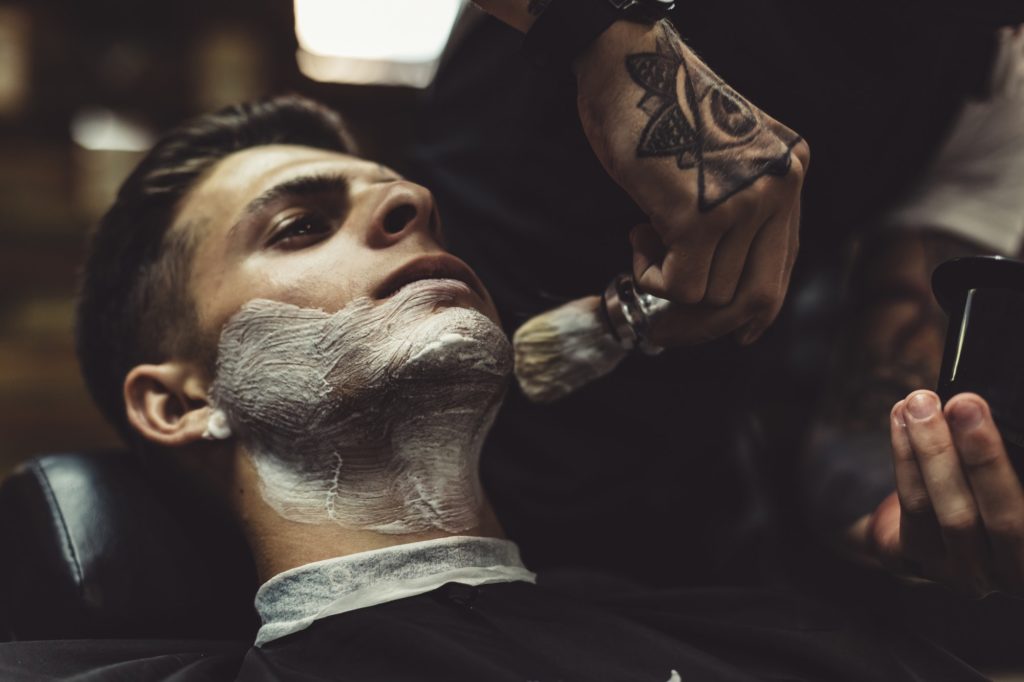 Barber shaving client